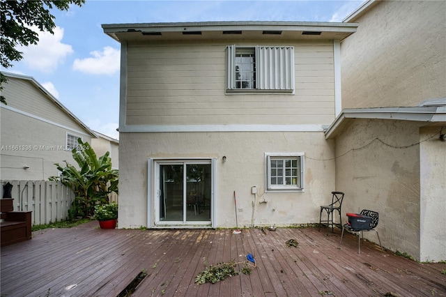 back of house featuring a deck