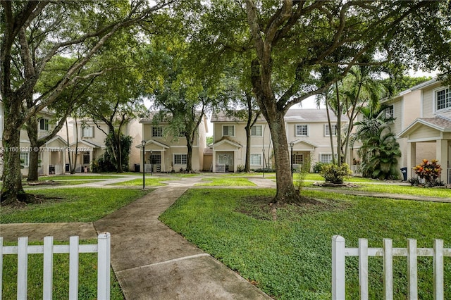 view of property's community with a yard