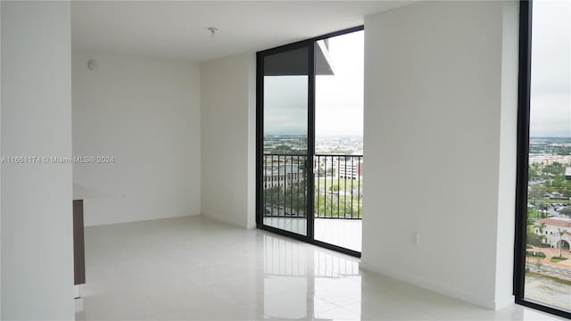 empty room with a wealth of natural light and expansive windows