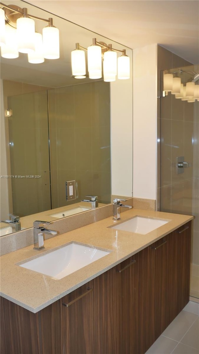 bathroom with tile patterned floors and vanity