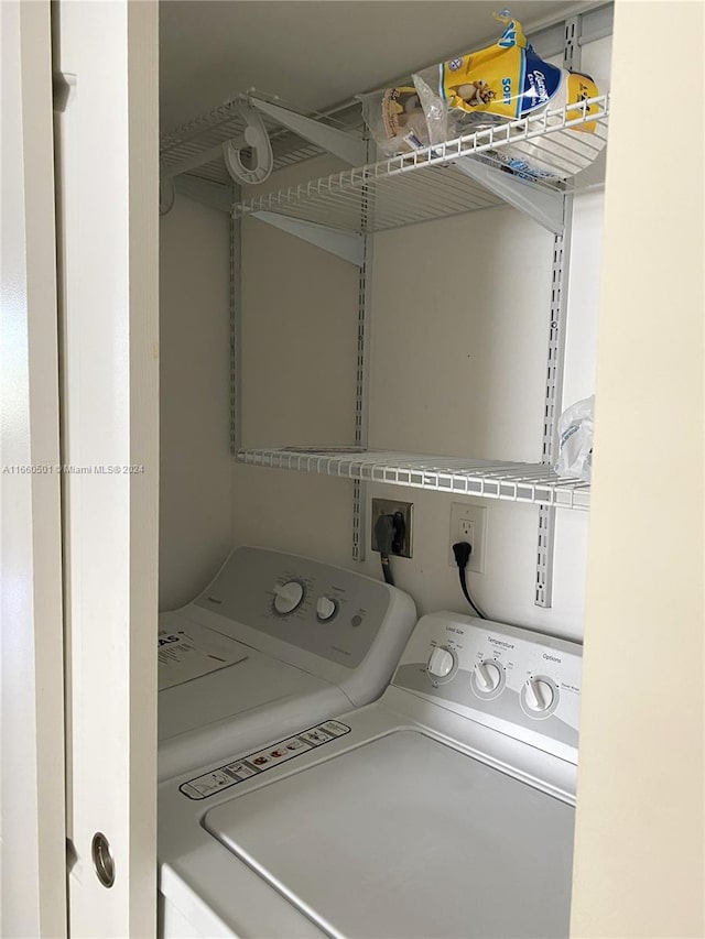 laundry room featuring washer and clothes dryer