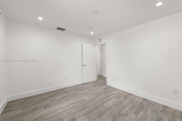 spare room featuring light hardwood / wood-style flooring