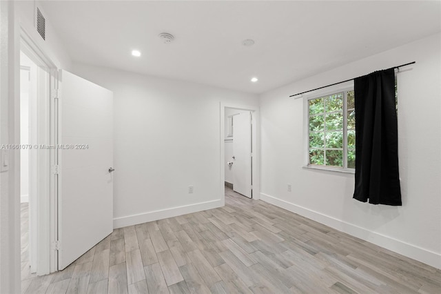 unfurnished room featuring light wood-type flooring