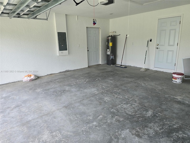 garage featuring electric water heater, electric panel, and a garage door opener