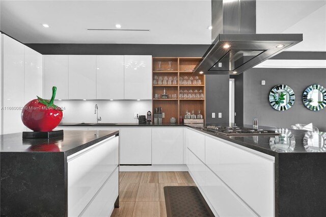 4701 N Meridian Ave Unit 510, Miami Beach, FL 33140 - kitchen featuring island range hood, open shelves, white cabinetry, a sink, and recessed lighting