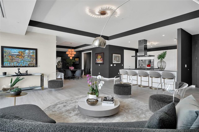 4701 N Meridian Ave Unit 510, Miami Beach, FL 33140 - living room featuring baseboards, a chandelier, wood finished floors, and recessed lighting