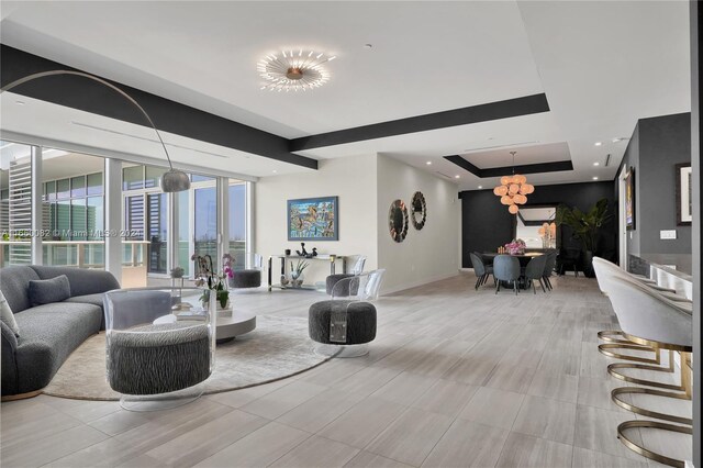 4701 N Meridian Ave Unit 510, Miami Beach, FL 33140 - living area with baseboards, french doors, and a tray ceiling