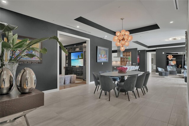 4701 N Meridian Ave Unit 510, Miami Beach, FL 33140 - dining space featuring a tray ceiling, a chandelier, and recessed lighting