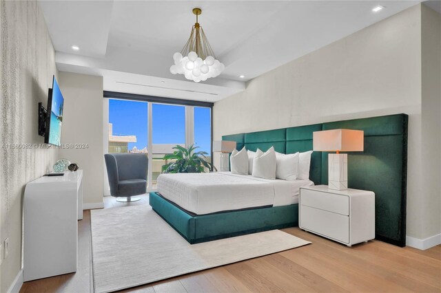 4701 N Meridian Ave Unit 510, Miami Beach, FL 33140 - bedroom with wood finished floors, a chandelier, recessed lighting, and baseboards