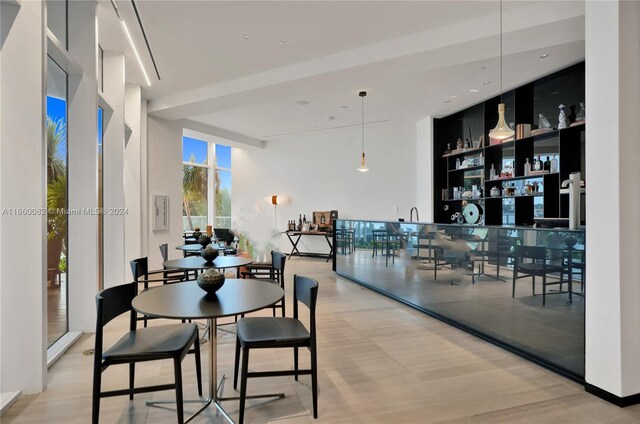 4701 N Meridian Ave Unit 510, Miami Beach, FL 33140 - dining space featuring wood finished floors and a community bar
