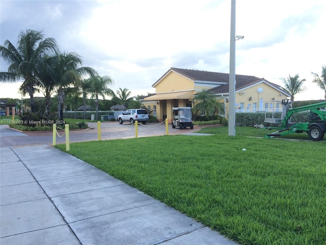 view of property's community with a yard