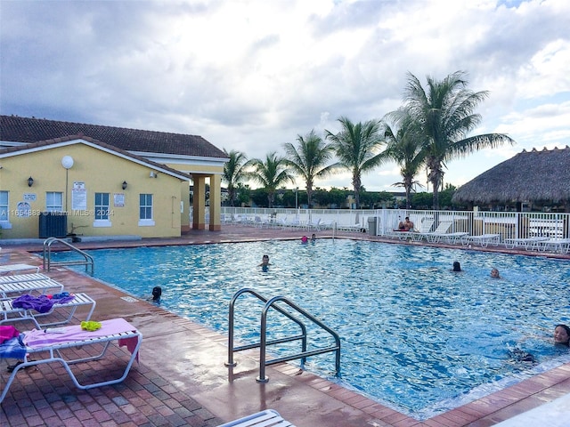 view of swimming pool with a patio area and a mountain view