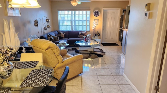 living room featuring ceiling fan and light tile patterned floors