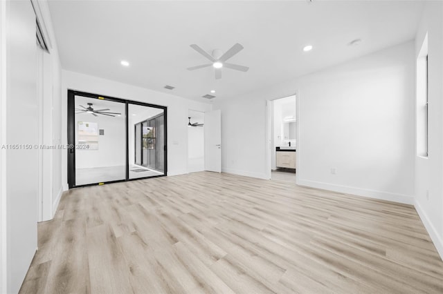 unfurnished room with ceiling fan and light wood-type flooring