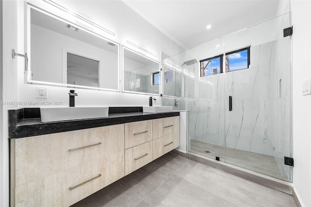 bathroom with walk in shower and vanity