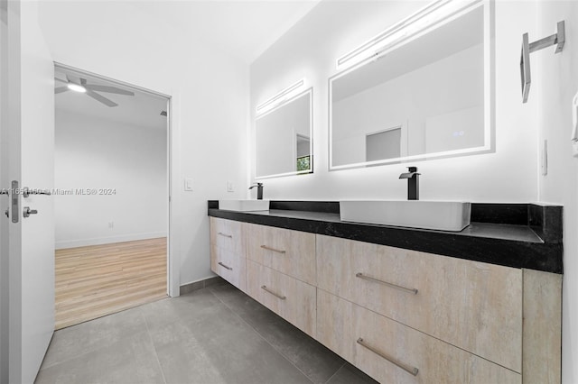 bathroom featuring ceiling fan, vanity, and hardwood / wood-style floors