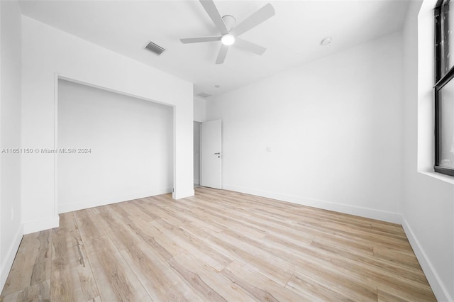 spare room with ceiling fan and light hardwood / wood-style flooring