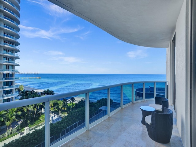 balcony featuring a water view