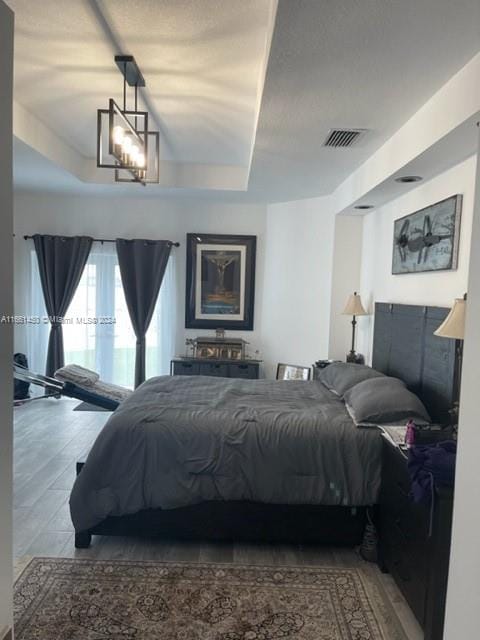 bedroom with a notable chandelier