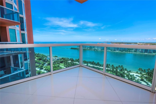 balcony featuring a water view