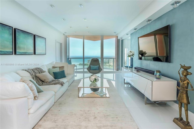 living room featuring floor to ceiling windows