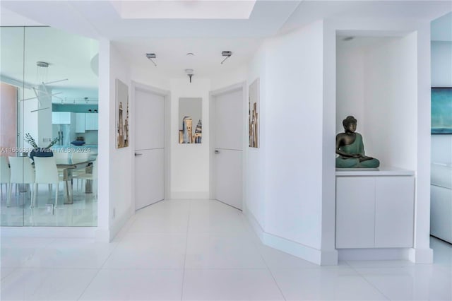 hallway with light tile patterned flooring