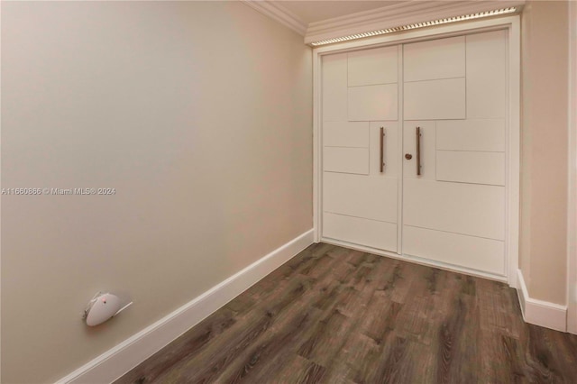 entryway featuring dark hardwood / wood-style floors and crown molding