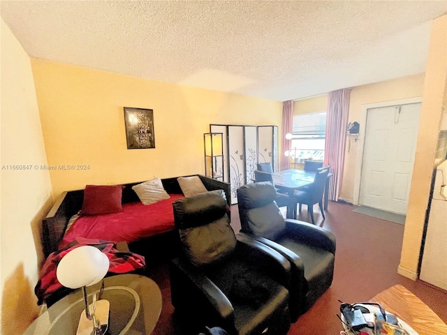 carpeted living room with a textured ceiling