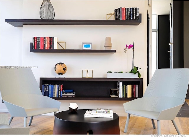 living area featuring hardwood / wood-style floors