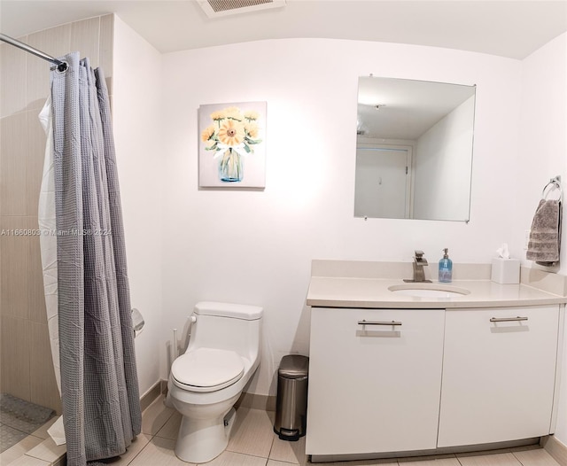 bathroom featuring a shower with curtain, vanity, toilet, and tile patterned floors