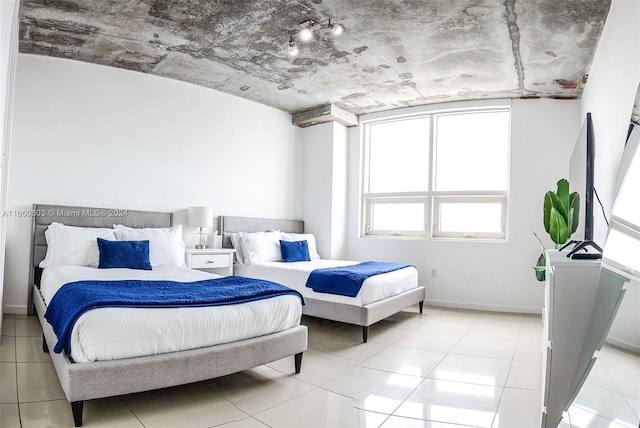 bedroom featuring light tile patterned floors