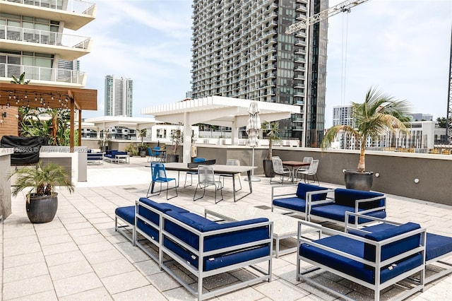 view of patio / terrace with an outdoor hangout area and a balcony