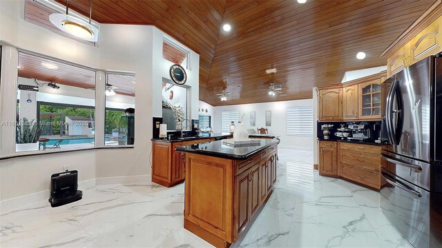 living room with high vaulted ceiling, wooden walls, and wood ceiling