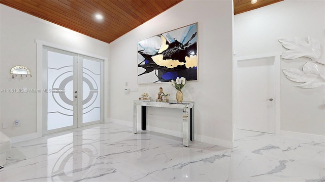 entryway featuring vaulted ceiling, wood ceiling, and french doors