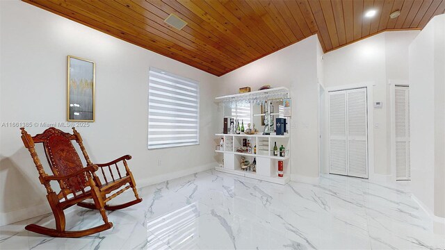 living area with wooden ceiling and vaulted ceiling