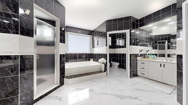 bathroom with a bidet, vanity, tile walls, and independent shower and bath