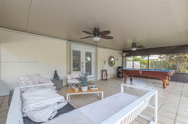 view of patio / terrace with a hot tub, ceiling fan, and french doors