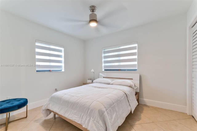 bedroom featuring ceiling fan and light tile patterned floors