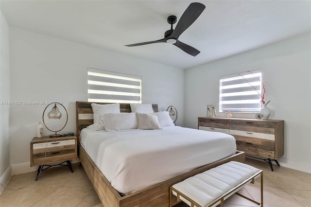 tiled bedroom with ceiling fan