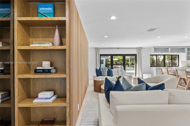 living room featuring visible vents and recessed lighting
