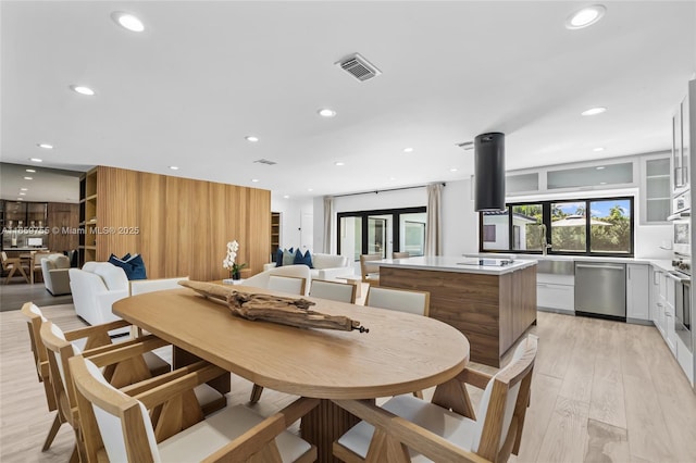 dining area with visible vents, recessed lighting, and light wood-style floors
