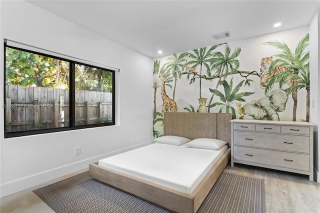 bedroom featuring light hardwood / wood-style floors