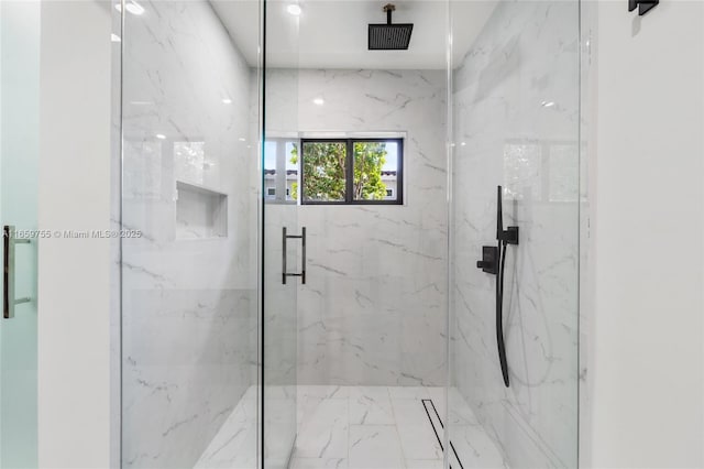 bathroom with a marble finish shower