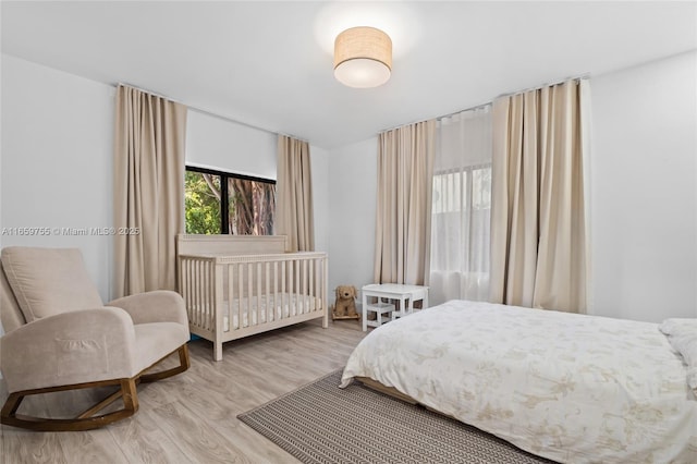 bedroom with light wood finished floors