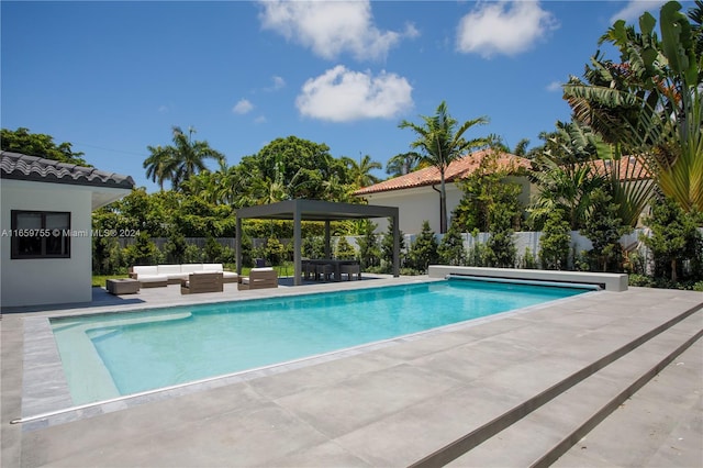 view of swimming pool with a patio and an outdoor hangout area