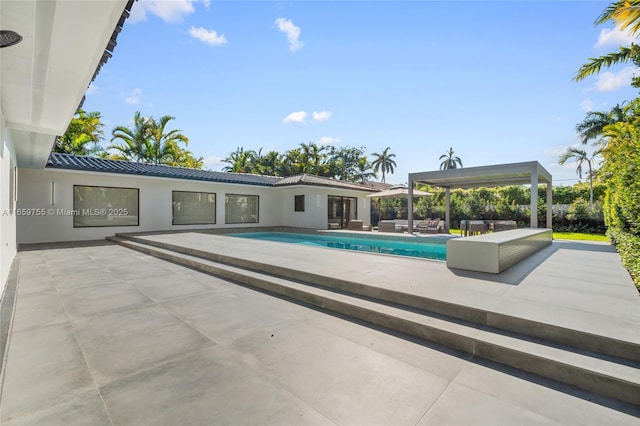 outdoor pool featuring a patio area