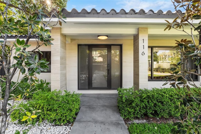 property entrance featuring covered porch