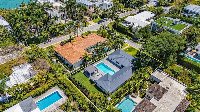 birds eye view of property with a residential view
