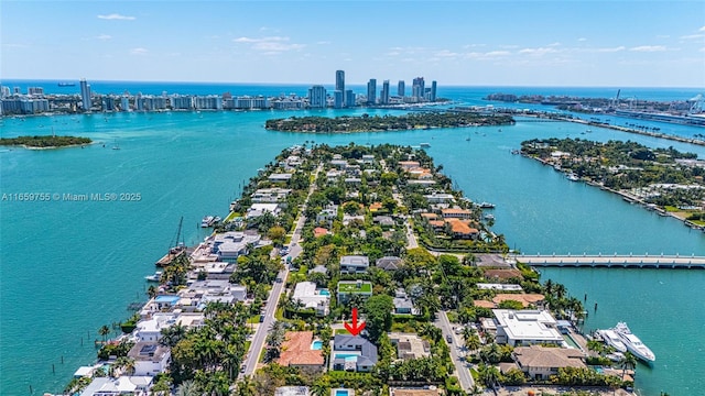 bird's eye view featuring a water view and a residential view