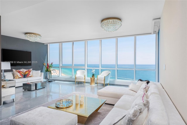 living room with a water view and a wealth of natural light